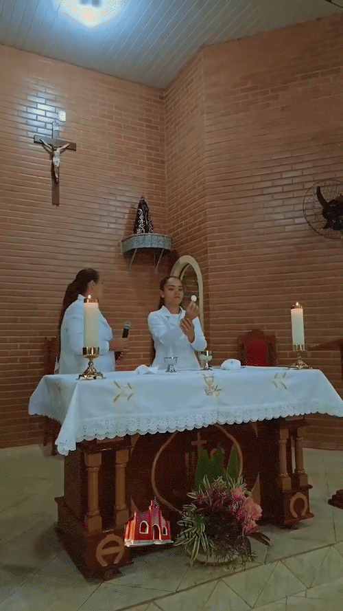 Woman giving Communion